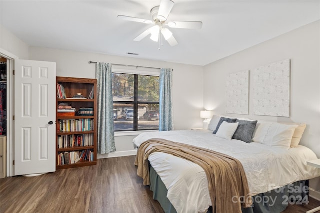 bedroom featuring ceiling fan and dark hardwood / wood-style flooring