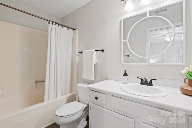 full bathroom featuring vanity, ceiling fan, toilet, and shower / tub combo