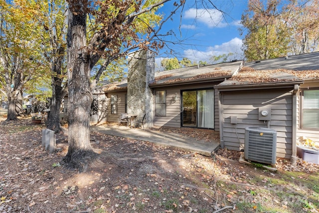 back of house featuring cooling unit and a patio