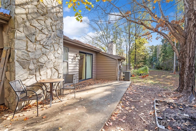 view of property exterior featuring a patio and central air condition unit