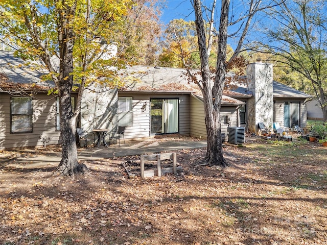 back of property featuring central AC and a patio area