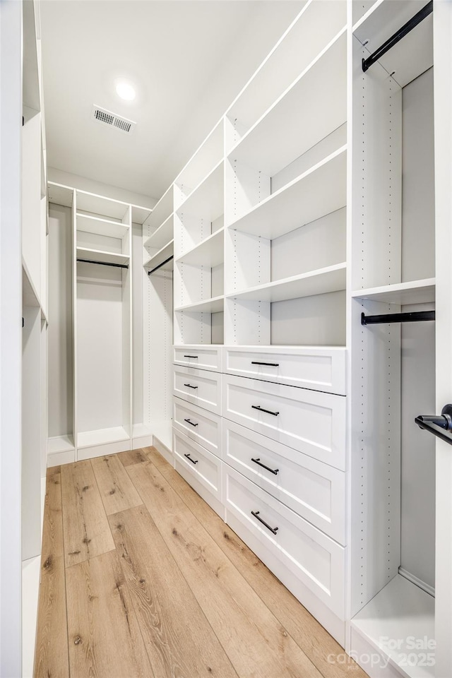 walk in closet featuring light wood-type flooring