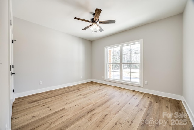 spare room featuring ceiling fan and light wood-type flooring