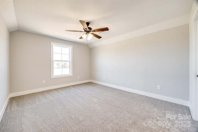 unfurnished room with vaulted ceiling, ceiling fan, and carpet