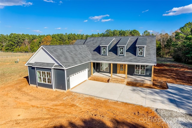 view of front of house featuring a garage and covered porch