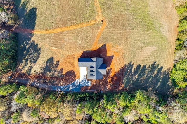 birds eye view of property with a rural view