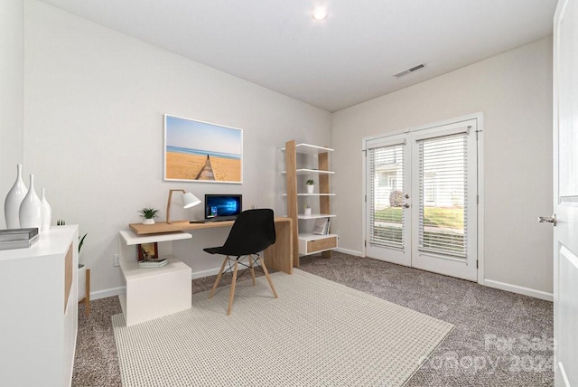 carpeted office space featuring french doors