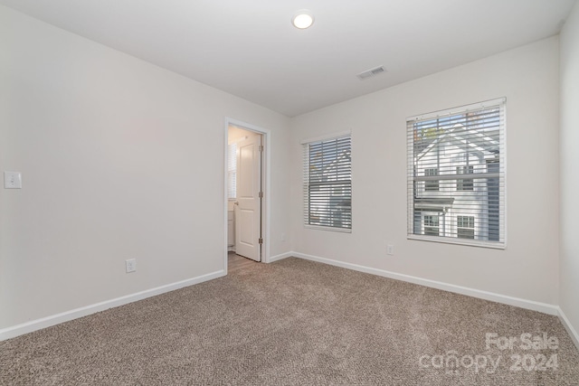 unfurnished bedroom with carpet flooring