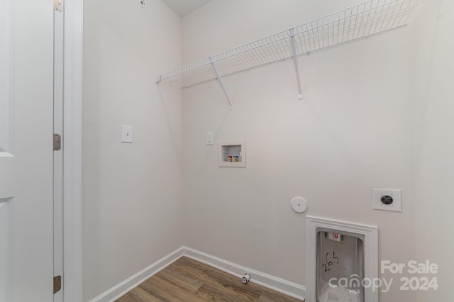 laundry room featuring electric dryer hookup, gas dryer hookup, wood-type flooring, and hookup for a washing machine