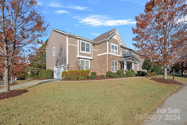 view of home's exterior featuring a lawn and a garage