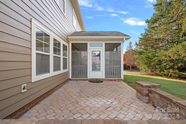 view of patio / terrace with a sunroom