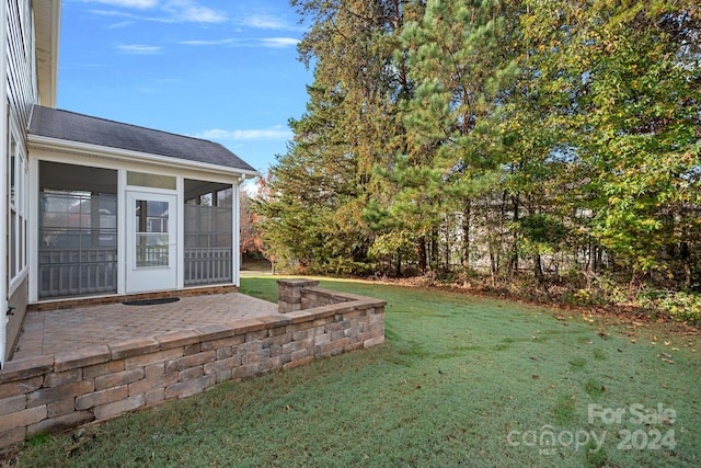 view of yard with a patio area and a sunroom