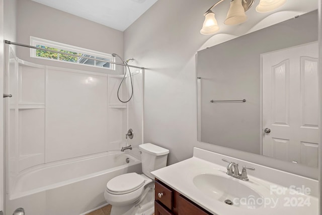 full bathroom with vanity, shower / bath combination, and toilet