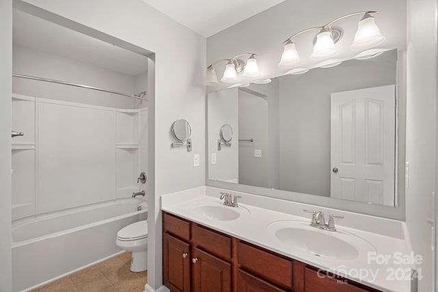 full bathroom with shower / tub combination, tile patterned flooring, vanity, and toilet