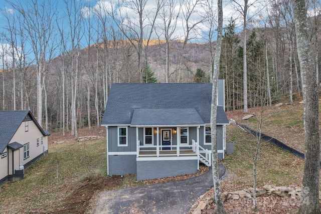 view of front of home featuring central AC unit and covered porch