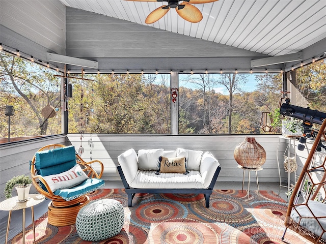 sunroom / solarium featuring ceiling fan and lofted ceiling