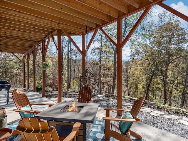 view of patio featuring a grill and an outdoor fire pit