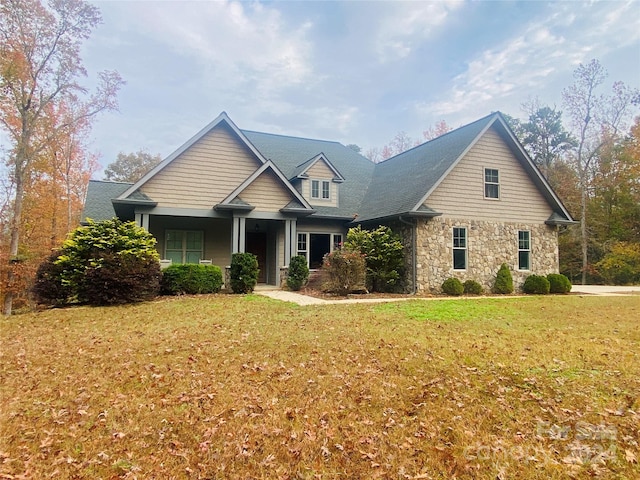 craftsman-style house with a front lawn