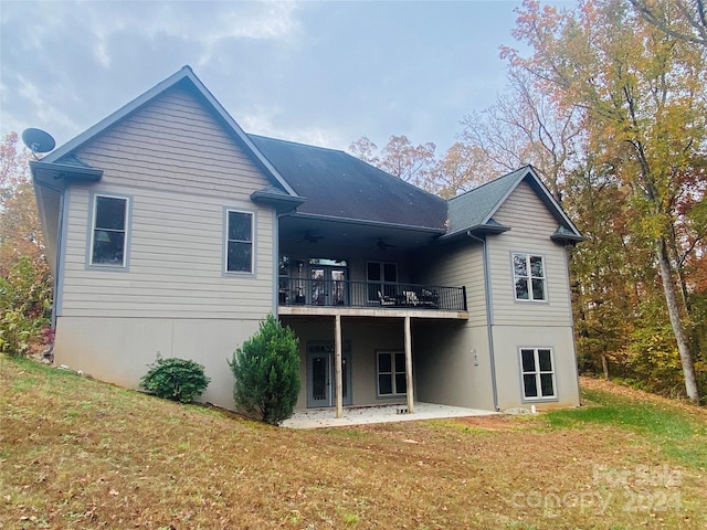 back of house with a yard, a patio, ceiling fan, and a wooden deck