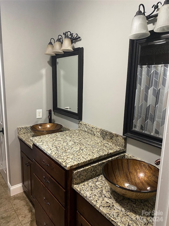 bathroom with tile patterned floors and vanity