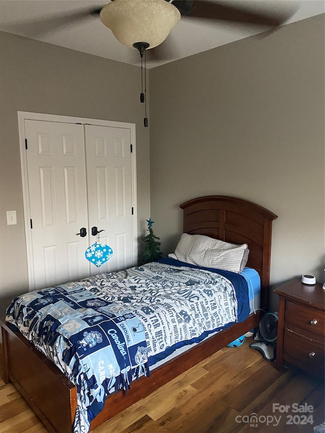 bedroom featuring a closet, hardwood / wood-style flooring, and ceiling fan