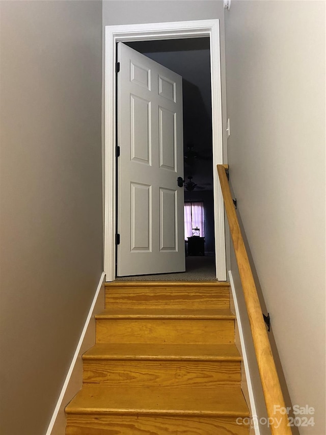 staircase featuring hardwood / wood-style flooring