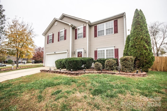 view of front of house with a garage and a front yard