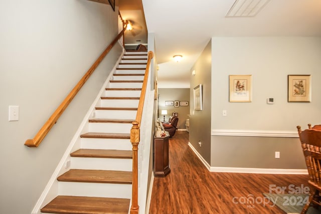 stairway with wood-type flooring