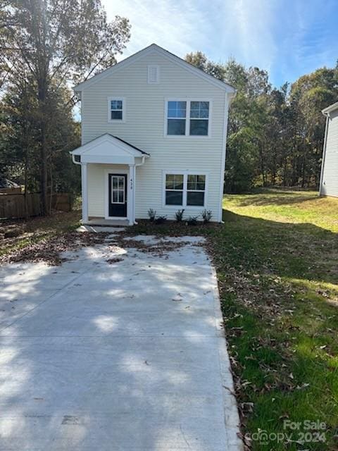 view of front of home featuring a front lawn