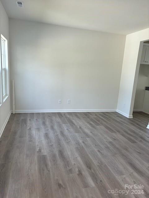 spare room with hardwood / wood-style flooring