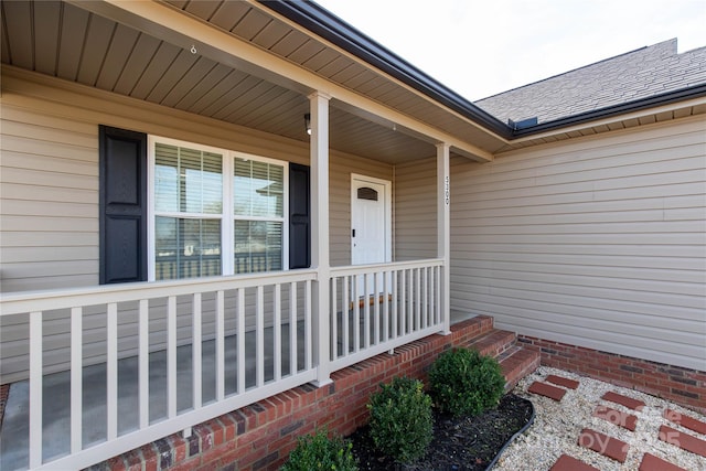 entrance to property featuring covered porch