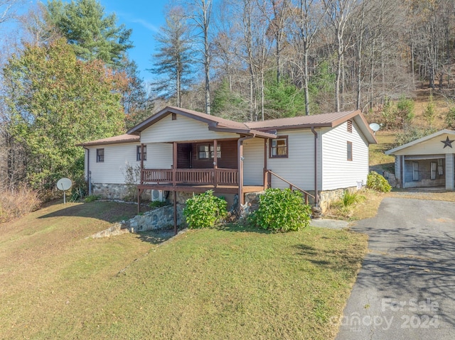 view of front of house with a front lawn and a porch