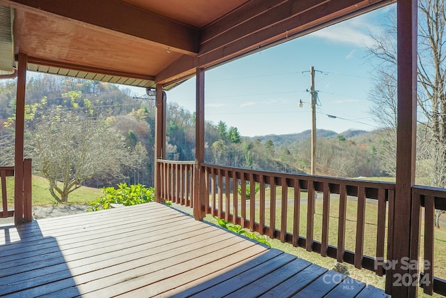 deck featuring a lawn