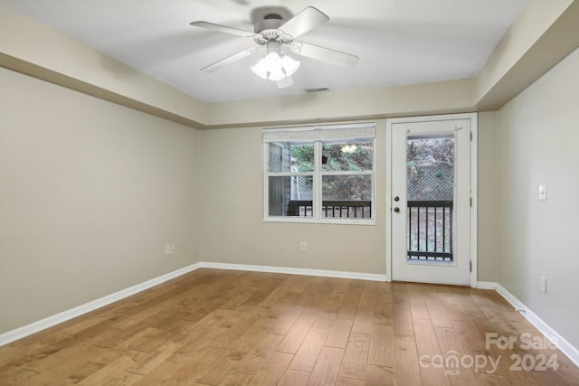 spare room with ceiling fan and light hardwood / wood-style floors