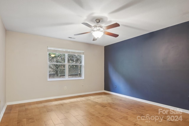 unfurnished room with ceiling fan and light hardwood / wood-style flooring