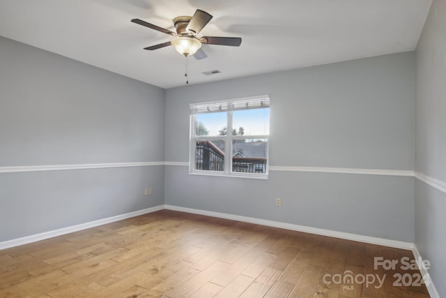 unfurnished room featuring ceiling fan and light hardwood / wood-style flooring