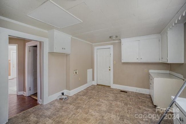 laundry room featuring cabinets and light wood-type flooring