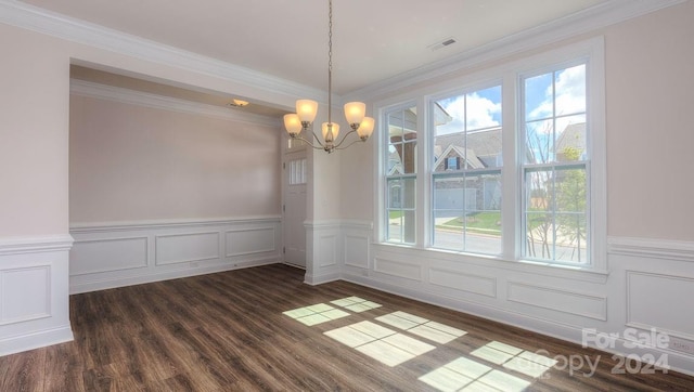 unfurnished dining area with a notable chandelier, ornamental molding, dark wood-type flooring, and a wealth of natural light