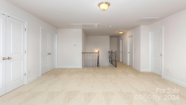 empty room with light colored carpet