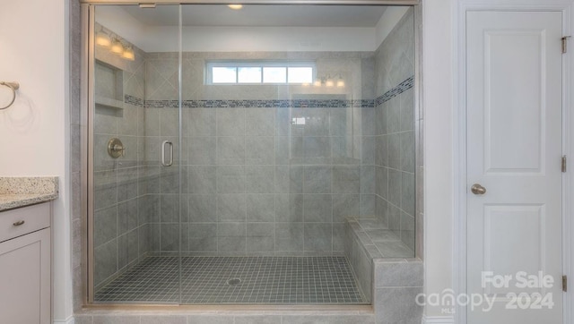 bathroom with vanity and walk in shower