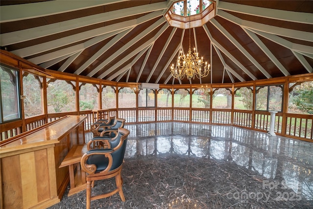 unfurnished sunroom with an inviting chandelier and vaulted ceiling