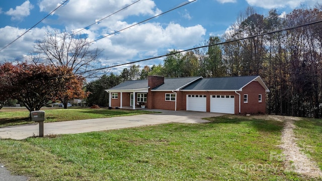 single story home featuring a front lawn and a garage