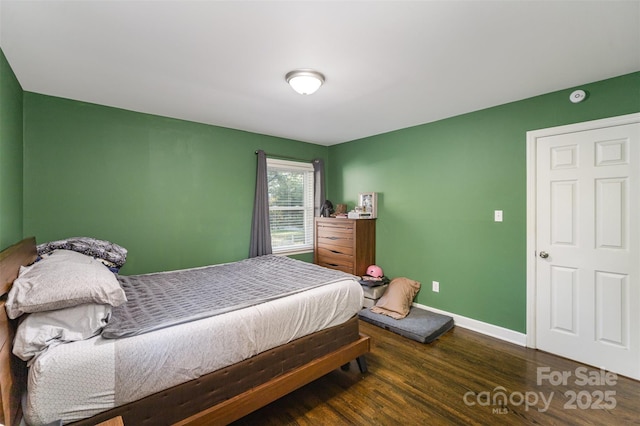 bedroom featuring dark wood-type flooring