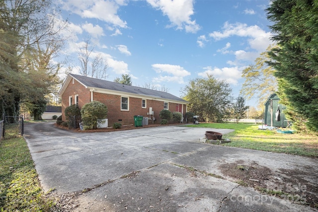 view of side of property with a yard