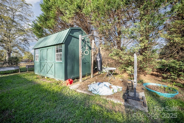 view of outdoor structure with a lawn