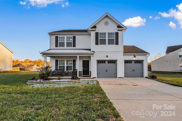 view of front property featuring a front yard and covered porch