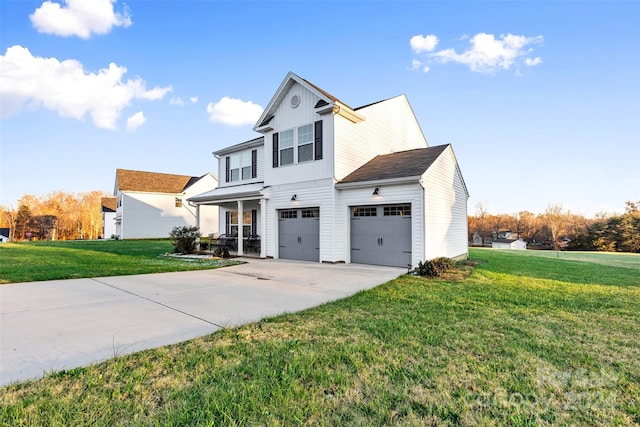 view of property with covered porch, a garage, and a front lawn