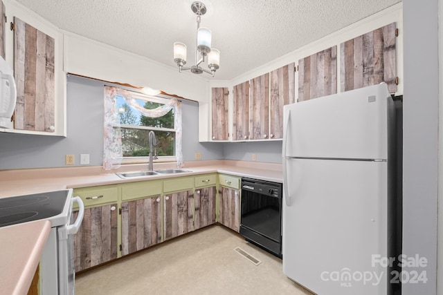 kitchen featuring a textured ceiling, white appliances, decorative light fixtures, and sink