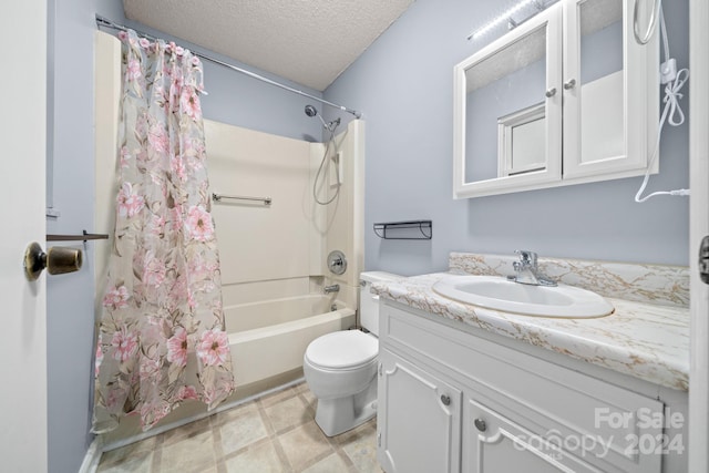 full bathroom with shower / tub combo with curtain, vanity, a textured ceiling, and toilet