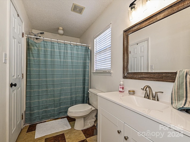 full bathroom with vanity, shower / bath combination with curtain, toilet, and a textured ceiling